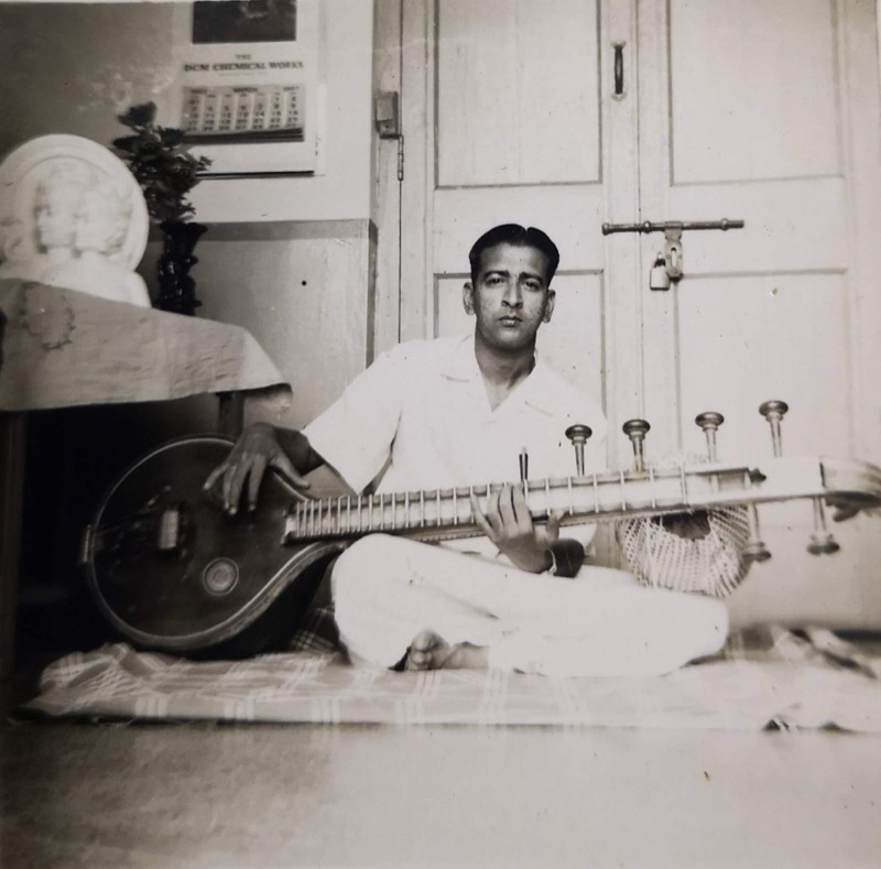 Neelamani seated with a veena